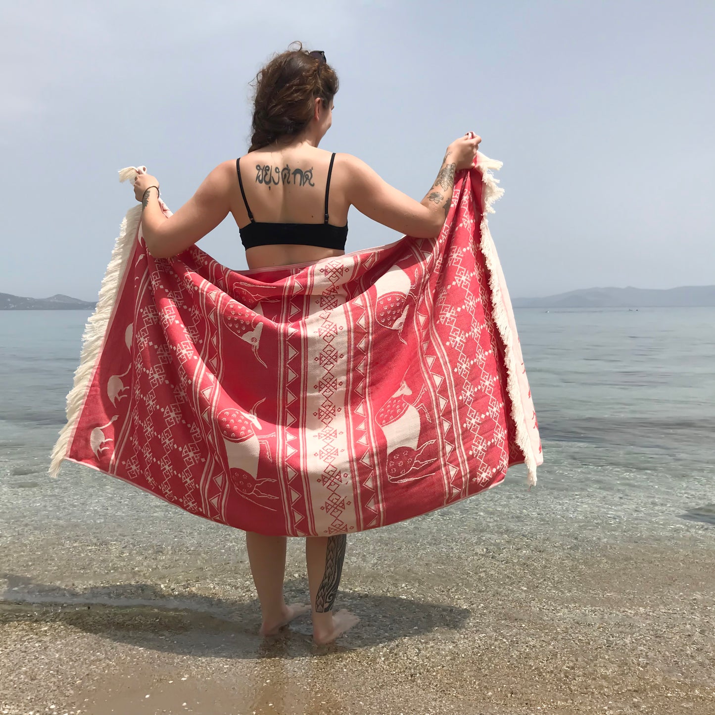 Minoan bulls woven beach towel